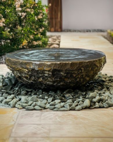 black limestone bowl water feature gently babbling away
