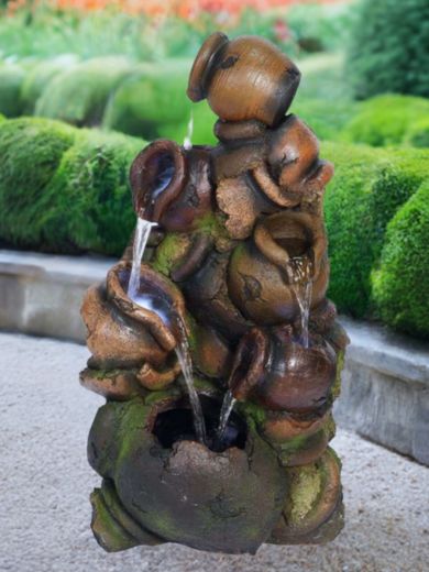Stacked Pouring Brown Pots