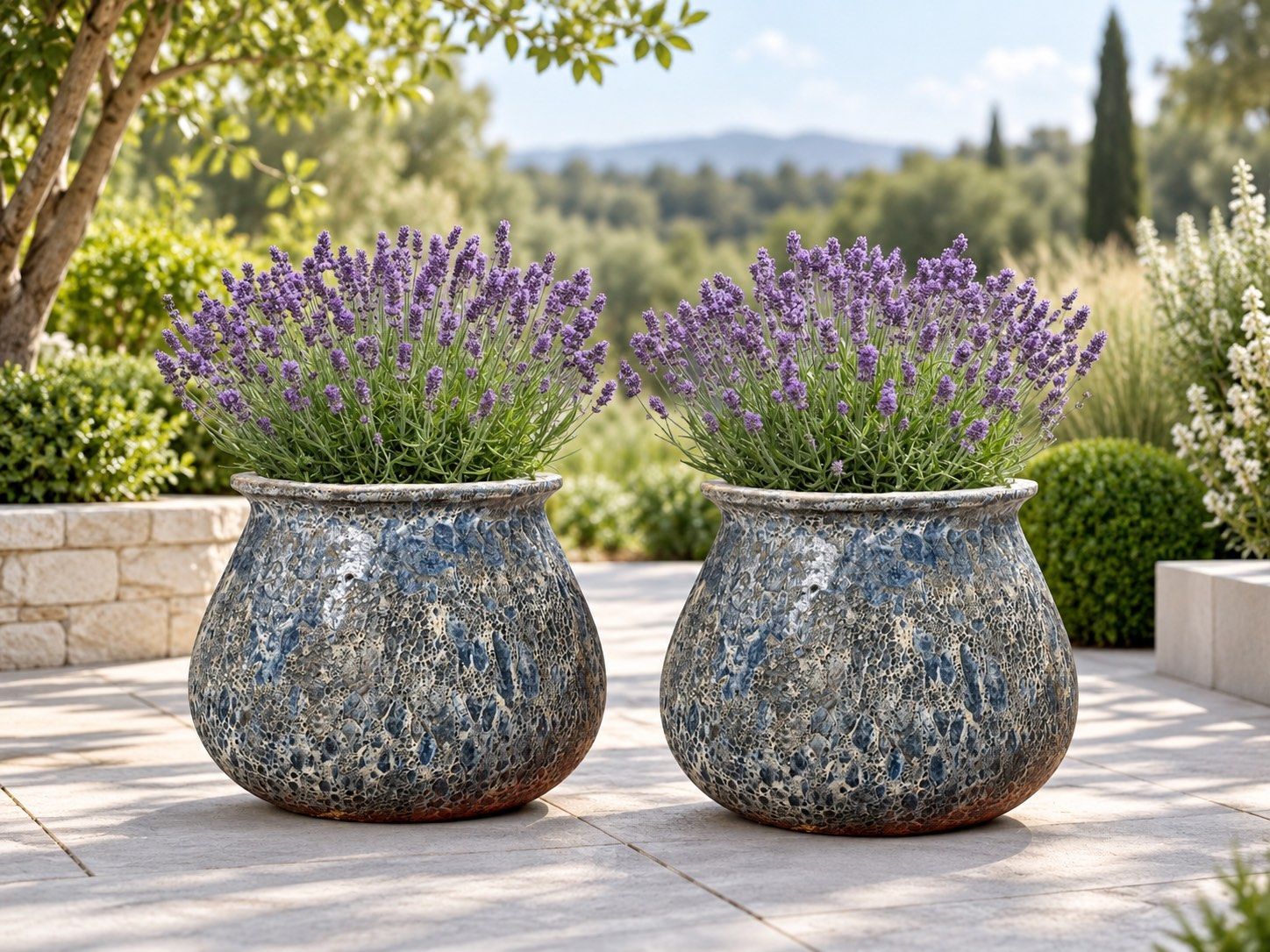 Aqua Moda large garden planters in a landscaped garden